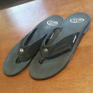 REEF flip flops with can opener on bottom